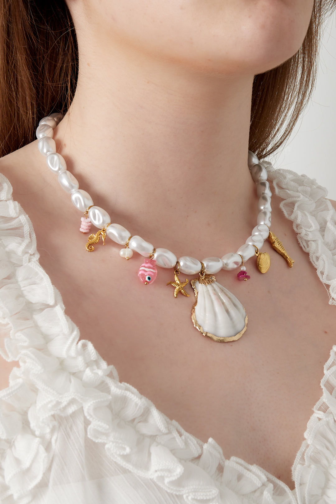 Ketting met parels en zeebedels
